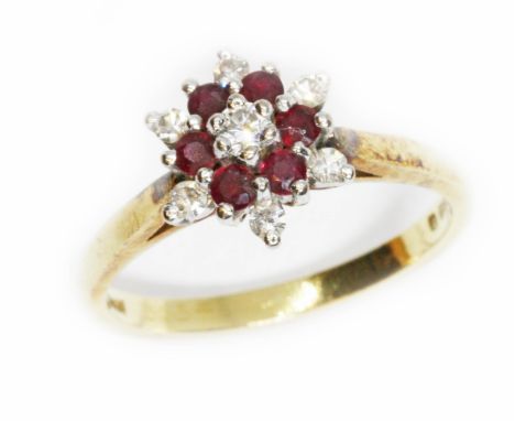 A hallmarked 18ct gold diamond and ruby cluster ring, gross weight 3.2g, size K.  Condition - good, general wear.