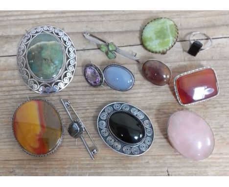 A collection of vintage hardstone cabochon brooches including silver.  