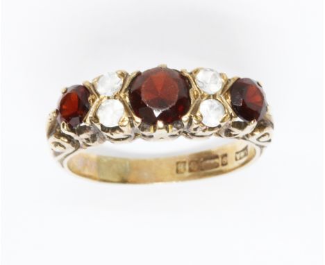 A hallmarked 9ct gold red and colourless stone ring, gross weight 3.1g, size M.  