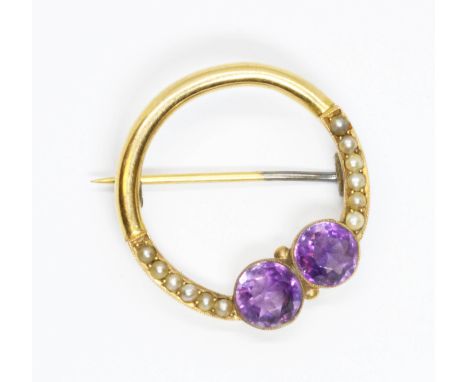 An early 20th century amethyst and split pearl brooch, unmarked, diameter 25mm, gross weight 3.3g.  