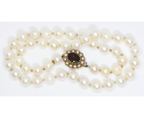 A cultured pear necklace, hallmarked 9ct gold garnet and split pearl clasp, length 36cm, gross weight 26.8g.  