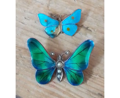 A hallmarked silver and enamel butterfly pendant and another marked 'Sterling'.  