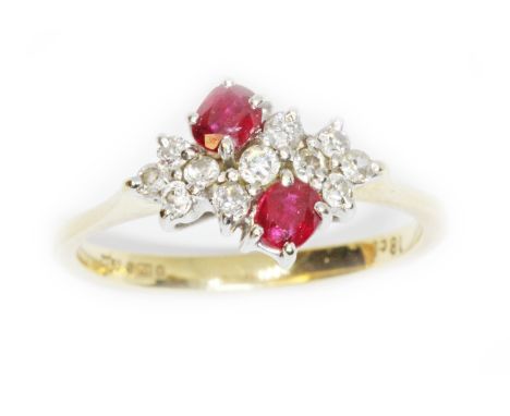 An 18ct gold ruby and diamond cluster ring, the cluster measuring approximately 13mm x 9.70mm, import marks, gross weight 3g,