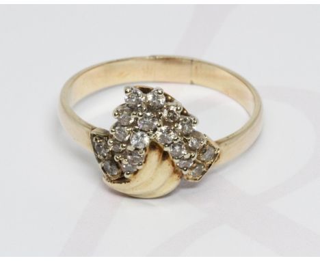 A diamond cluster ring, band unmarked, gross weight 3.4g, size N.  