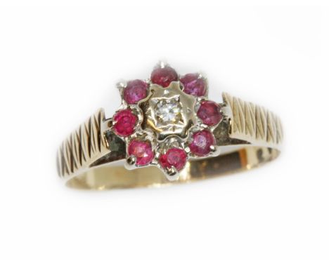 A hallmarked 9ct gold diamond and ruby cluster ring, gross weight 2.6g, size N.  Condition - good, general wear.