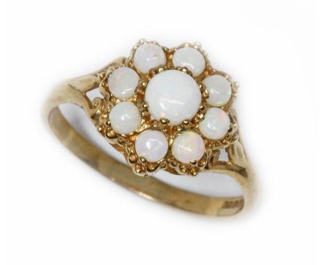 A 9ct gold opal cluster ring, the cluster 11mm in diameter, London 1991, gross weight 2.2g, size O.  Condition - good, genera