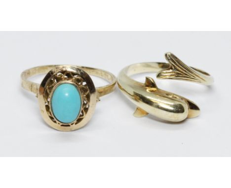 A yellow metal turquoise cabochon ring and a dolphin ring marked '585', gross weight 5.6g, size M.  
