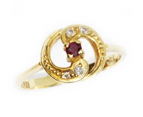 A diamond and ruby ring, marked '750', gross weight 2.6g, size L/M.  Condition - general wear.