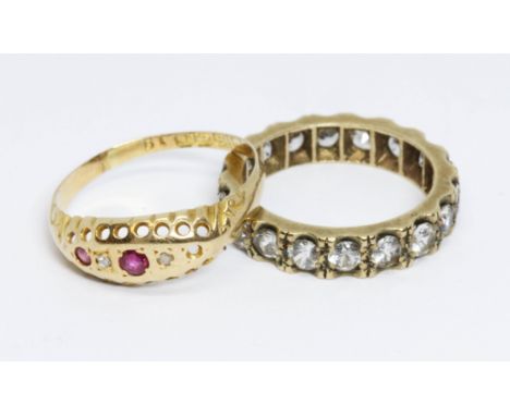 Two rings: an antique hallmarked 18ct gold diamond and ruby ring, weight 1.6g, size L and a colourless stone eternity band ma