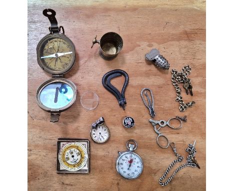 A mixed lot including a ladies silver pocket watch, a Negretti &amp; Zambra pocket forecaster, a reproduction compass, a stop