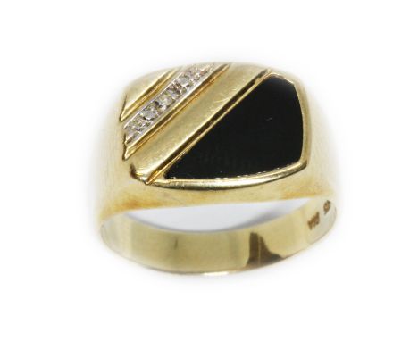 A 9ct gold diamond and black onyx ring, international convention marks, gross weight 3.4g, size R.  Condition - good, general