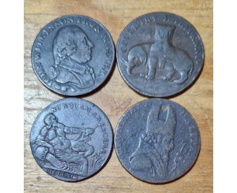 A group of four copper 1/2 penny tokens comprising an 1792 coventry lady godiva-elephant, 1791 john wilkinson iron master, 17