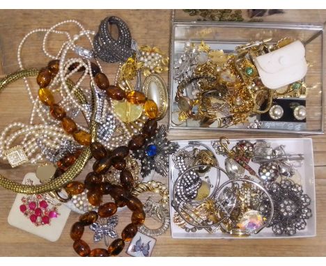 A box of assorted vintage costume jewellery.  