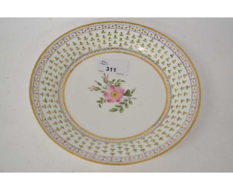 A Swansea porcelain plate the floral centre bordered by a chevron design in gilt and green, 20cm diameter