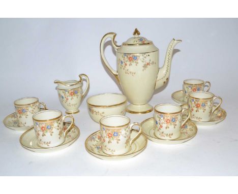 An English porcelain coffee set comprising six coffee cans, saucers, milk jug and coffee pot in the Old English series by Jac