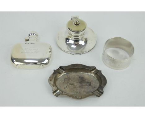 Antique silver hip flask engraved St Moritz, capstan inkwell, ashtray and a 1970s napkin ring.&nbsp; All fully hallmarked. In