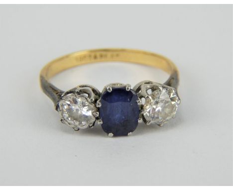 18ct gold and platinum diamond and sapphire trilogy ring, size O. Diamonds approx 0.5ct each. Gross weight 2.6 grams