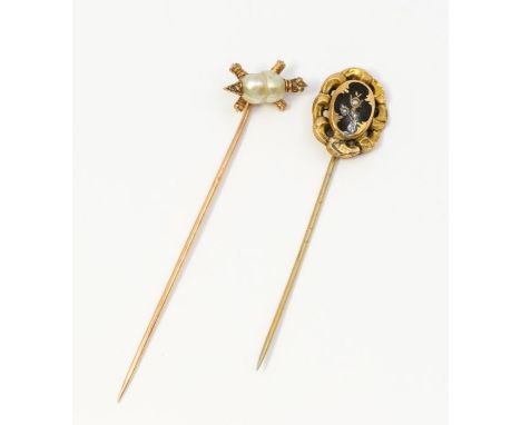 Two late 19th - early 20th century stick pins. One featuring a tortoise with a body made of a baroque pearl and set with diam