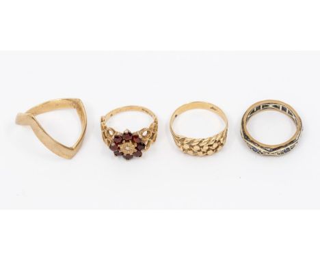 A collection of ladies rings. Featuring a 9ct gold wishbone ring (size U); a garnet and diamond cluster ring (size K); A 9ct 