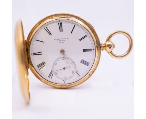 A Gentleman's full hunter pocket watch in 18ct gold. The case is engraved with initials to the front and patterned with an en
