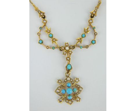 An elegant Edwardian 15ct gold chain and pendant inset with turquoise and seed pearls. Chain length 38cm, pendant drop 4cm. P