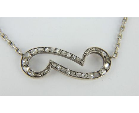 Diamond set white gold necklace with scroll pendant and interspaced diamond chain. Bolt ring is a silver replacement. Length 