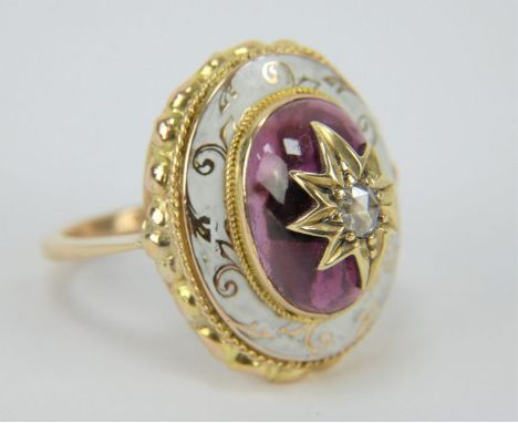 Gold and enamel garnet cabochon ring with central inset central diamond, size M.&nbsp; 20mm x 15mm. Gross weight 4.75 grams