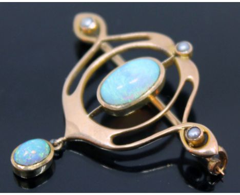 An Edwardian Art Nouveau opal and seed pearl brooch, the central precious oval opal cabochon in rub over setting measuring ap