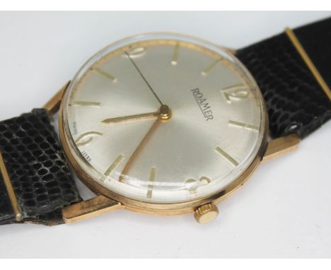 A 1960s hallmarked 9ct gold Roamer wristwatch with signed champagne dial, hands and hour markers in gold, snap back case, ref