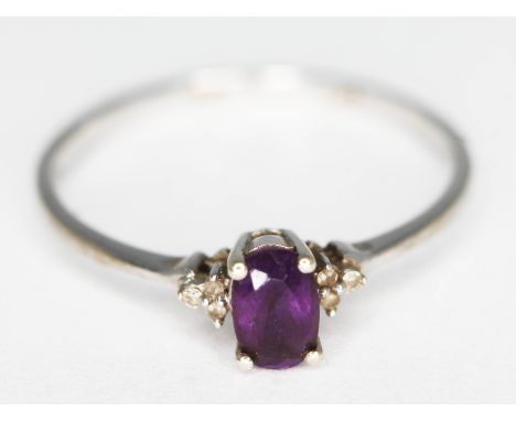 A diamond and amethyst ring, hallmarked 9ct white gold, gross wt. 1.54g, size S.  