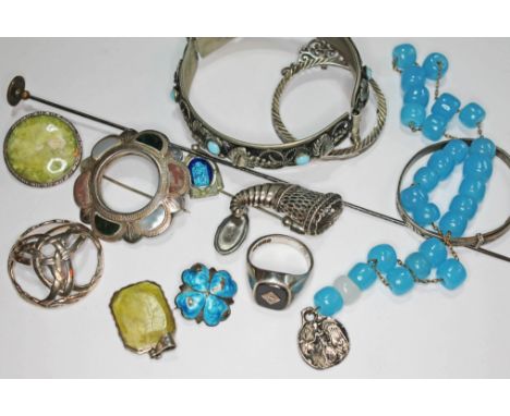 A mixed lot of silver and white metal jewellery including a signet ring, a bangle, a Scottish brooch, a hallmarked silver Art