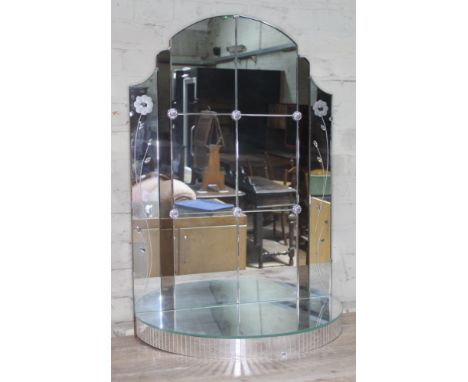 An Art Deco panelled glass mirror with lower demi-line shelf, chrome rosettes and etched glass flowers, height 88cm.  