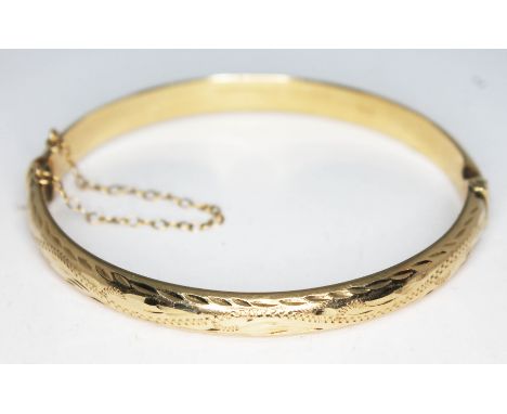 A hallmarked 9ct gold bangle, diam. approx. 58mm, wt. 8.26g.  