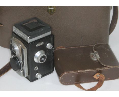 A Weltaflex medium format camera together with a Ross Ensign.  