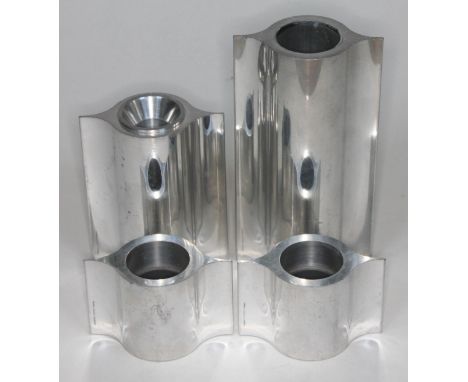 Georg Jensen, a group of four aluminium tea light candle holders, heights 6cm - 18cm.  