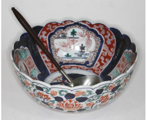 A 19th century Japanese Imari bowl, diam. 27.5cm, and silver plated punch ladle with turned wooden handle.  