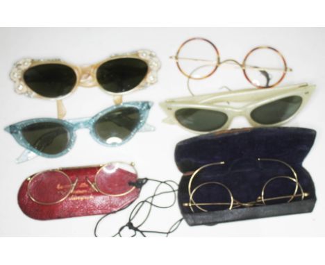 A quantity of vintage spectacles including 1950s ladies fashion sunglasses and gold plated spectacles.  