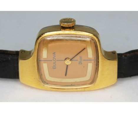A vintage 1970s gold plated Bulova Christian Dior 7219 ladies wristwatch with double signed dial featuring gold outer band in