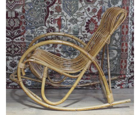 A vintage cane rocking chair in the manner of Franco Albini. 