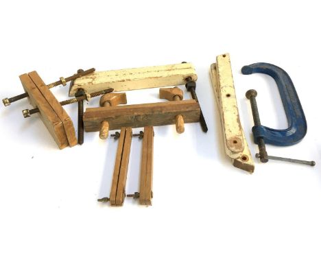 A collection of vintage wooden clamps, possibly for book binding, together with a very large Record G-clamp, an several large