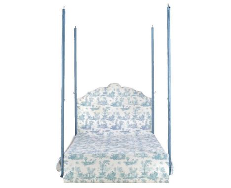 A modern tester bed with rosette canopy (not visible), hung with turquoise and white double lined Chinoiserie drapes, counter