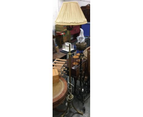 A brass standard lamp with shade 