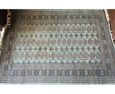 A green West Persian carpet, 128cmW 
