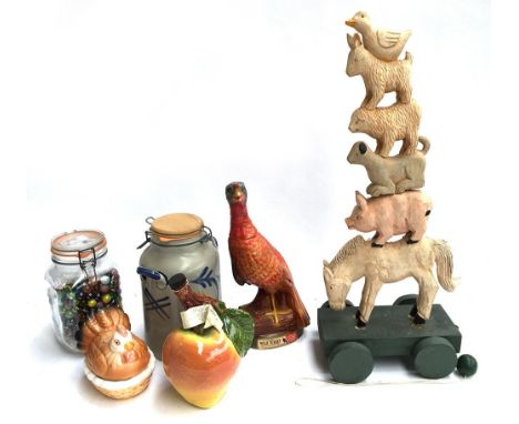A mixed lot to include a German carved pull along wooden animal stack, a 'Wild Turkey Kentucky Bourbon' ceramic bottle; ceram