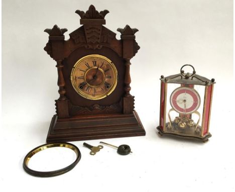 A carved American mantel clock (af), with key and pendulum, marked Ansonia Clock Co. New York; together with one other 