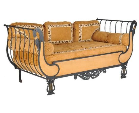 A painted cast iron sofa, in Empire style, 20th century, with suede cushions and bolsters, 105cm high, 211cm wide