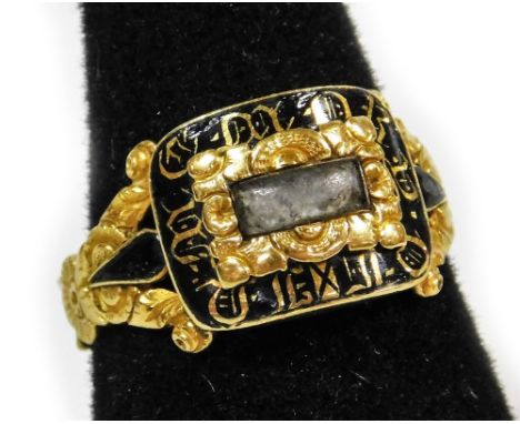 A Victorian memorial ring, by maker J.B &amp; Co, with rectangular memorial panel centre, surrounded by gold scroll decoratio