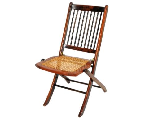 A late 19thC bergere folding chair, with a stick back, caned seat and X frame legs, when open 77cm H.