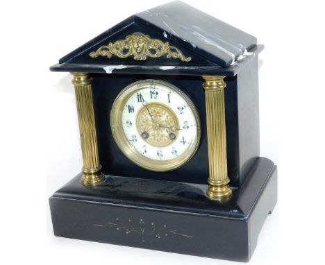 A Victorian black slate mantel clock, the 10cm Dia. Arabic dial raised with gilt metal flowers and flanked by reeded columns,