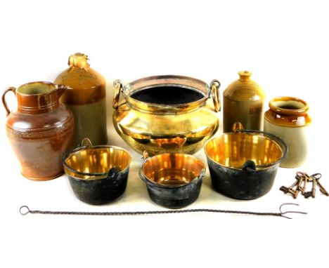 An early 20thC brass spittoon,  of bellied circular form, with ring handles and a plain interior, on circular foot, 7cm H, th